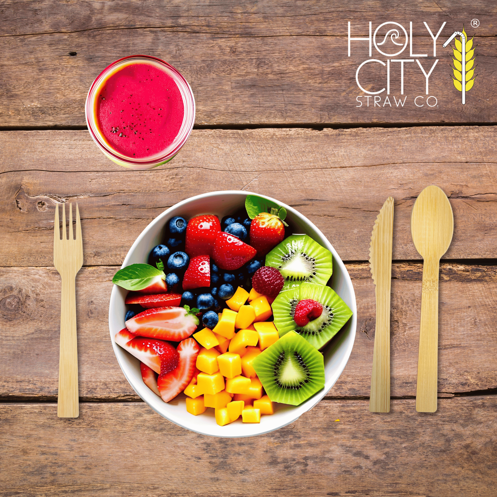 Holy City Straw Co. unwrapped bamboo cutlery next to color fruit place setting