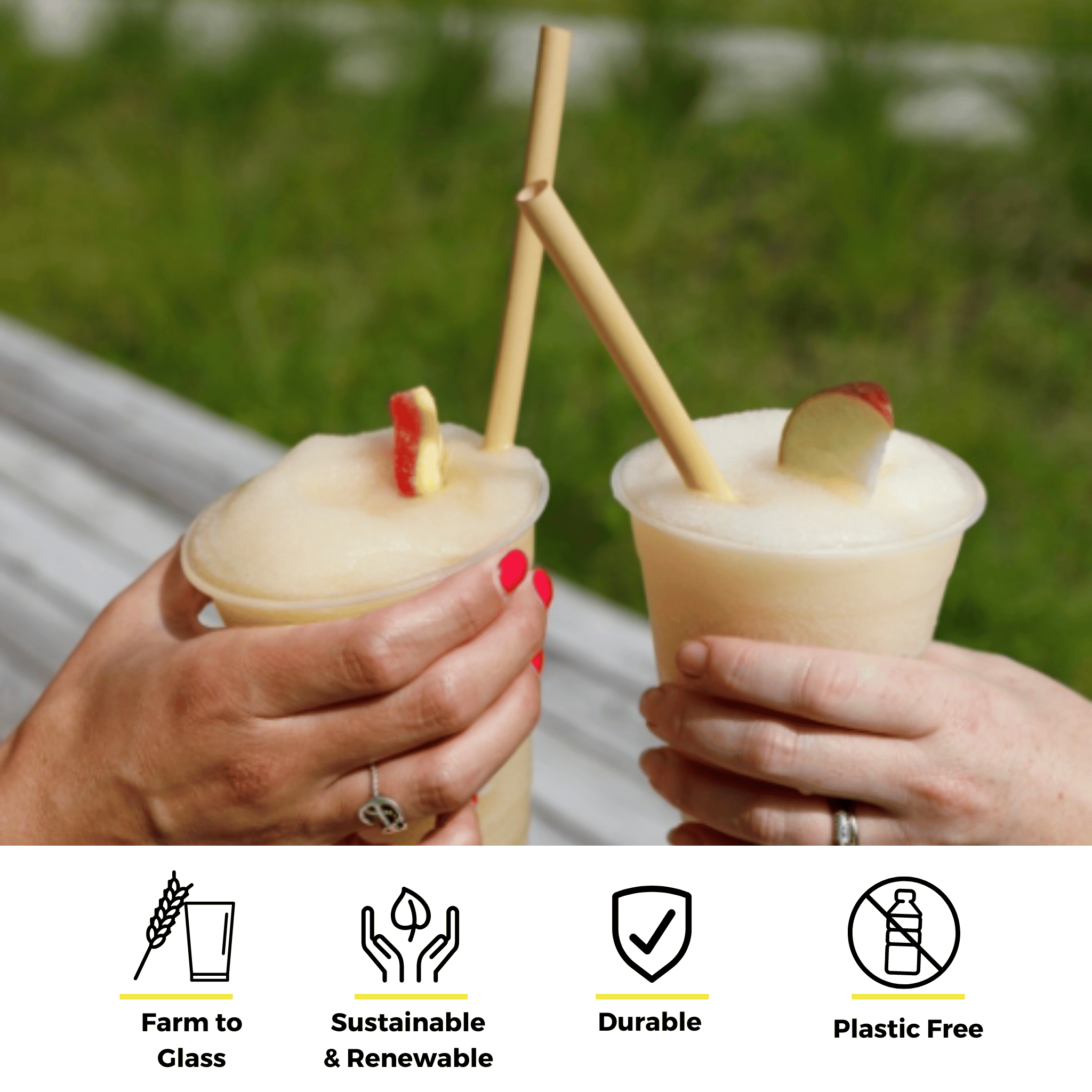 Two hands holding frozen drinks with reed stem straws, garnished with apple slices, outdoors. Text below emphasizes eco-friendly features: farm to glass, sustainable & renewable, durable, and plastic-free.