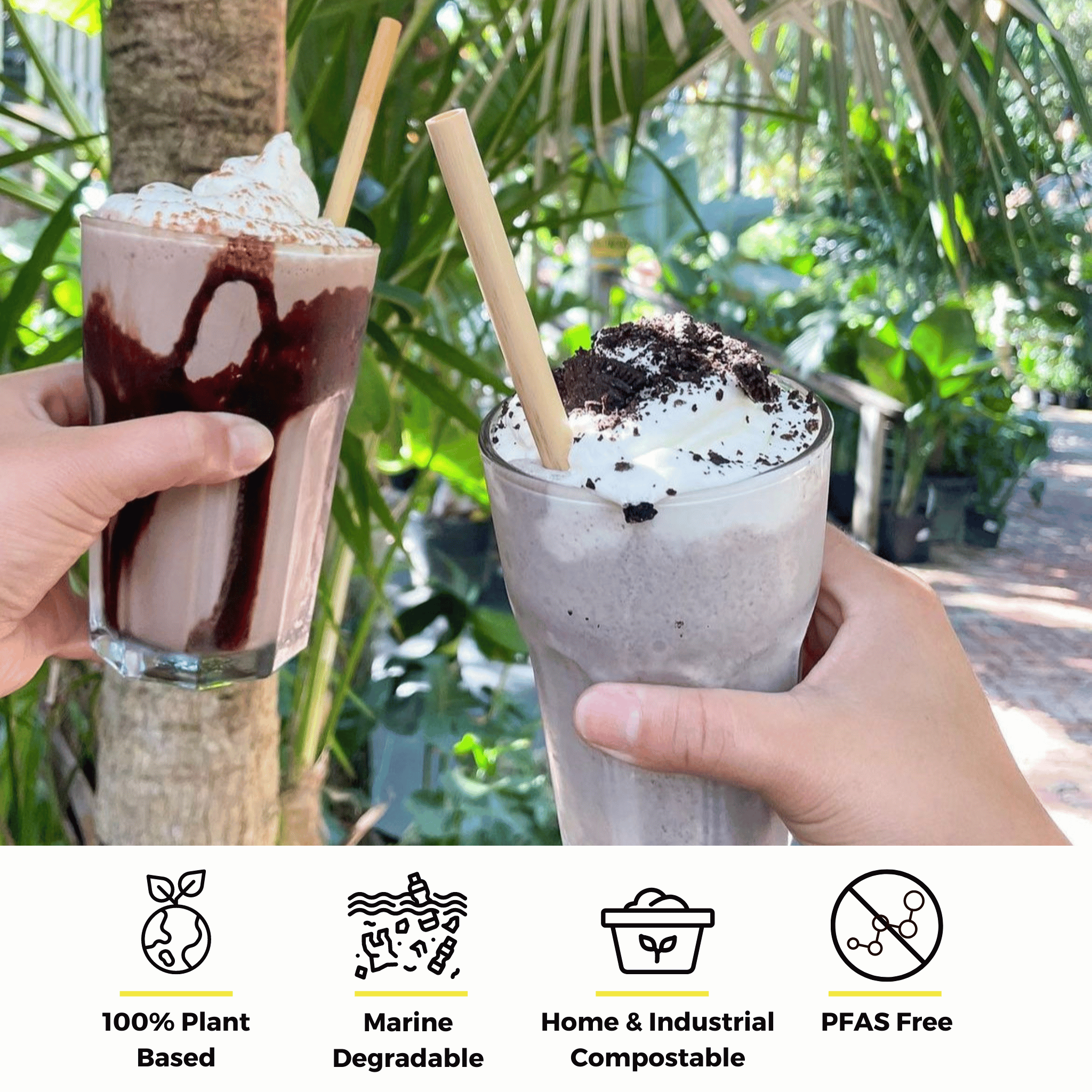 Two hands holding milkshakes with reed stem straws, one chocolate and one cookies and cream, in a garden setting. Text below highlights the straws' features: 100% plant-based, marine degradable, home & industrial compostable, and PFAS-free.