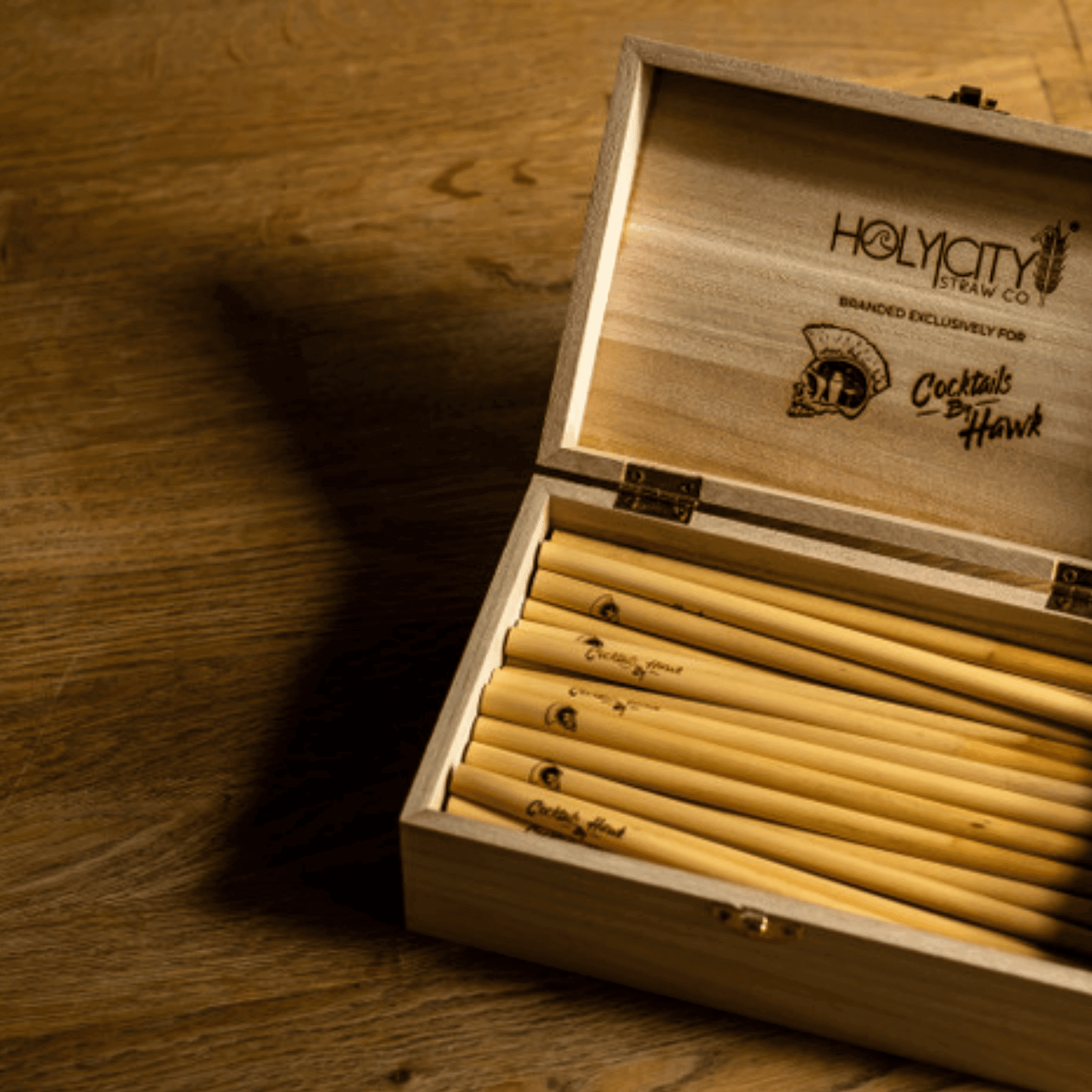 Cocktails by Hawk Branded box and straws made by Holy City Straw Company.png