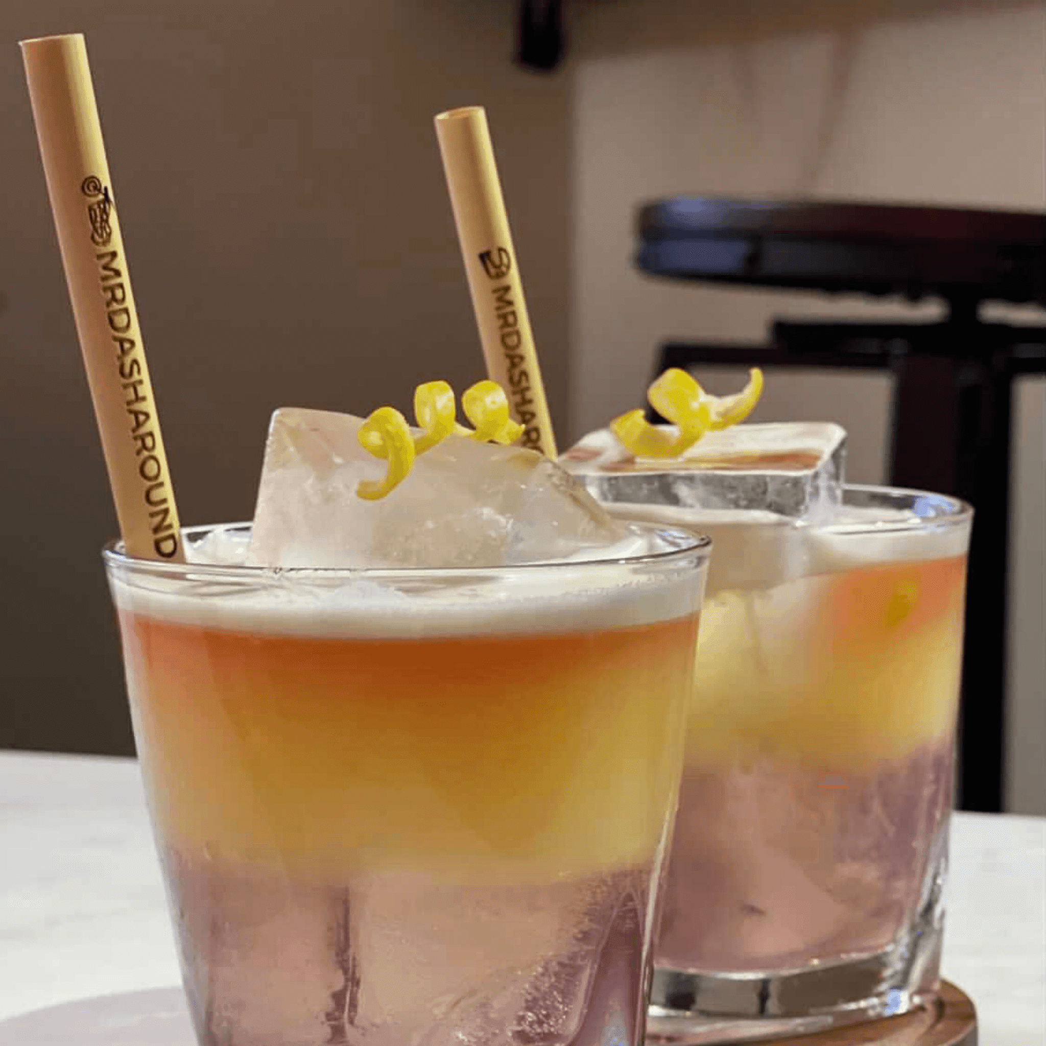 Mr Dasharound branded straws inside tropical cocktail
