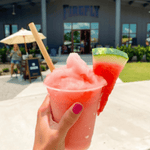 hand holding frozen watermelon drink